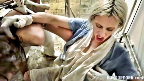 Blonde nurse in blue uniform dominating man in intense Hellspital horror porn scene