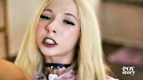 Seductive blonde with heavy makeup and choker gives intense POV stare moaning in porn closeup