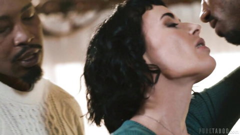 Brunette woman with short hair passionately kissing black man while another BBC stud watches in intense interracial threesome