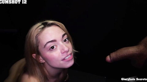 Young blonde at gloryhole with massive black cock near her open mouth
