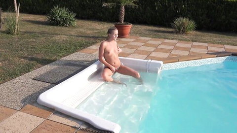 Cayla Breast blonde babe nude solo by outdoor pool, legs spread