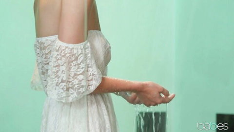 Woman in sheer lace dress with dripping hands in Seth Gamble's passionate Babes scene