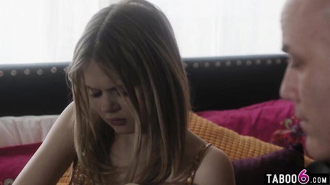 Petite blonde teen stepdaughter gazes shyly at DILF stepdad on colorful bed in taboo scene