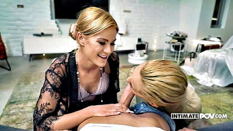 Blonde in black lace lingerie fingers pussy of smiling blonde babe on table POV