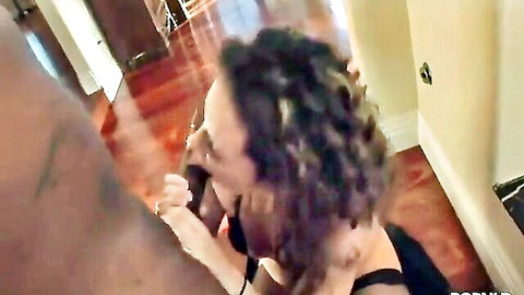 Curly haired babe deepthroating massive black cock in hallway