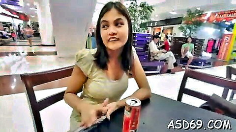 Thai amateur babe sticks out tongue teasingly at mall table in off-shoulder top