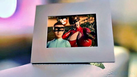 Busty superheroine in red latex with masked partner, cosplay pose