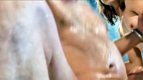 Kelsey Michaels close to erect cock in wet bathroom scene