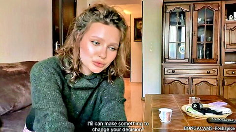 Curly-haired brunette in green sweater tempts to change decision