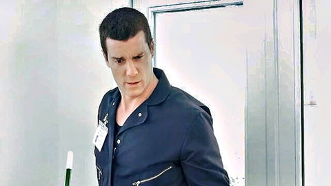 Handsome muscular janitor in fitted uniform, intense expression for anal roleplay