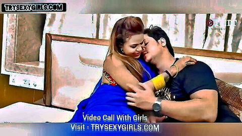 Indian bhabhi in blue sari intimately hugging husband's brother