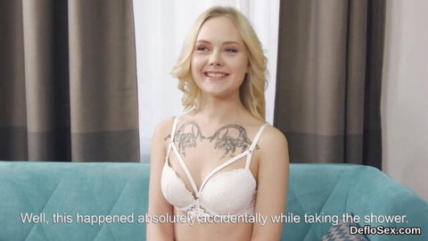 Petite blonde teen smiling with perky tits and hard nipples exposed in white lace harness bra