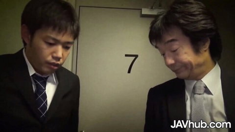 Japanese suited young man and older man outside door 7 in JAV scene