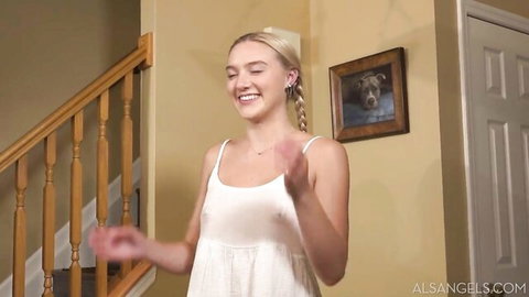 Molly Cooper blonde with pigtails in sheer white dress, smiling playfully