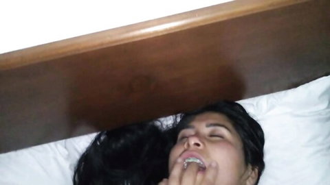 Latina woman deepthroating with tongue out on bed, amateur oral
