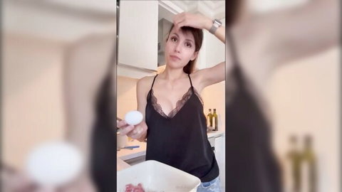 Arianarealtv in black lace top cooking seductively with egg