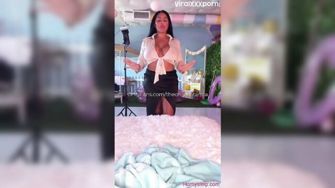 Kiara Mia teases in sheer white blouse and black mini skirt