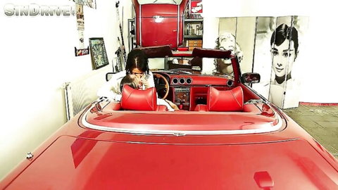 Two retro women in shiny clothes cruise in red convertible, vintage fantasy drive
