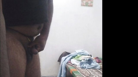 Dark-skinned man stroking hard cock in gay solo encounter