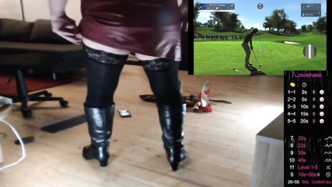 Wicki von Trannyston trans mistress in red mini skirt, black stockings, thigh-high boots showing lace panties