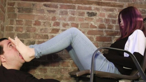 Tamara's sweaty bare feet pressed on man's face in foot fetish tease