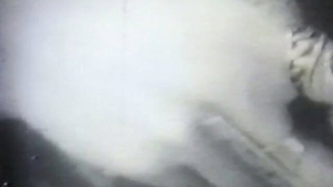 Blurry vintage bedroom scene with skinny brunette and white fluid splash