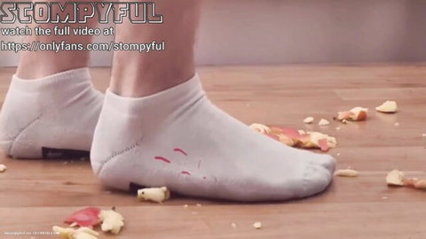 Woman's feet in white socks crushing apples, foot fetish crush trailer