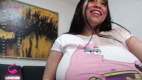 Colombian webcam girl smiling with massive tits bursting from tight SpongeBob t-shirt