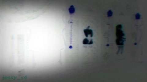 Mysterious silhouette woman in green dress with shadowy figures under blue lamps