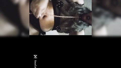 Masked blonde lady in sexy mesh top and chain belt, teasing close-up