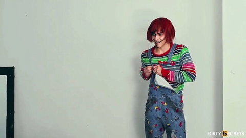 Emma Anturin in sexy Chucky cosplay, teasing in striped sweater and overalls