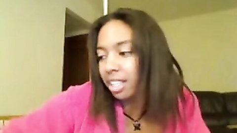 Young ebony teen in open pink robe on cam, solo tease