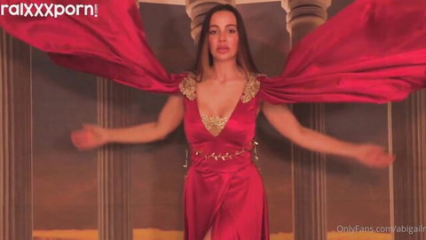 Abigail Mac as sexy Goddess Athena teases in revealing red gown