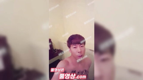 Naked East Asian man with open mouth moaning in steamy bathtub