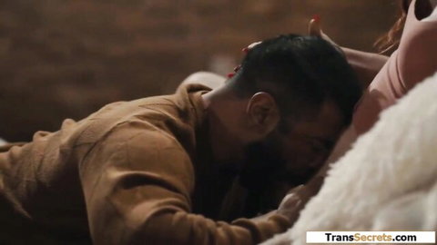 Bearded man nuzzling busty trans stepdaughter in pink top and bed