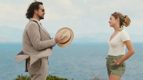 Shailene Woodley sexy clothed scene with man on beach cliff in Killer Heat 2024