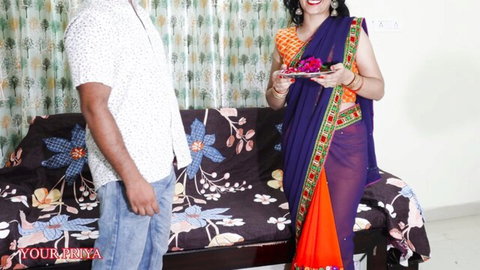 Indian step-sister in colorful saree teases brother in home setting