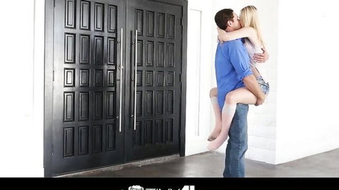 Lily Rader passionately embraced and kissed by man in standing carry