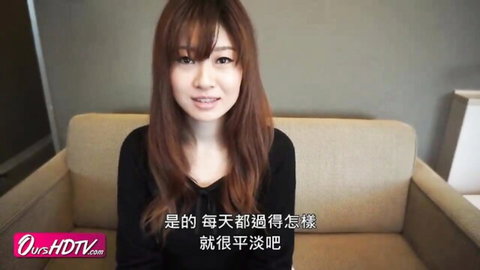 Smiling busty Japanese MILF in black v-neck top, long brown hair