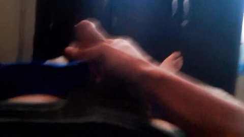 Blurry close-up of hand touching female soles in foot fetish masturbation scene