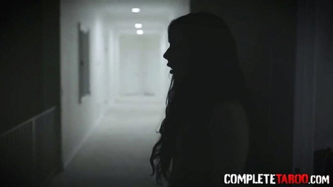 Amateur teen brunette with long hair in dimly lit hallway tease