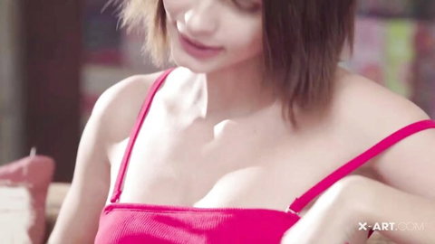 Lilliane in red low-cut top, teasing cleavage close-up