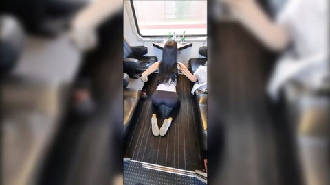 Hot hotwife in tight leggings teasing on train with bare feet up