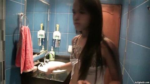 Kelly Kutie in sexy bathroom tease, young Asian beauty with long hair