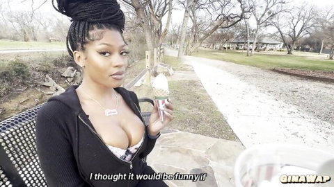 Gina WAP teases with ice cream cone in park, deep cleavage in unzipped hoodie