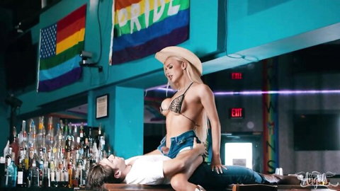 Angellica Precious straddles Archi Page in skimpy bikini and cowboy hat
