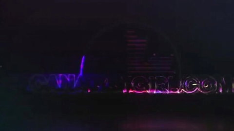 Purple neon OnlyGirls.com logo glowing on dark background for hot trans brunette solo masturbation videos