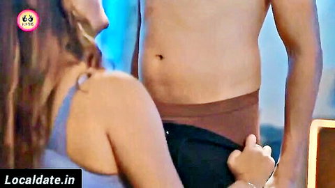 Desi woman undressing muscular man in intimate foreplay scene