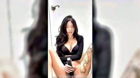 Cute Asian OnlyFans teen posing seductively in black lingerie