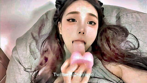 Asian girl with long hair sucking pink dildo in solo tease